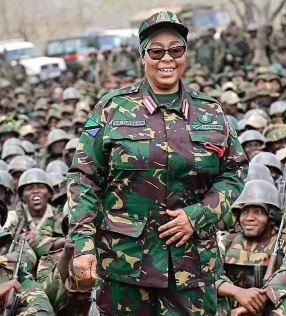 President Samia Suluhu Hassan in military uniform amongst soldiers.