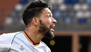 Macauley Bonne goes up for a header against Angola at the Africa Cup of Nations