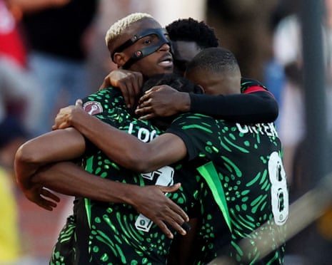 Victor Osimhen (left) celebrates with teammates after opening the scoring in Nigeria’s 2-0 victory over Algeria.