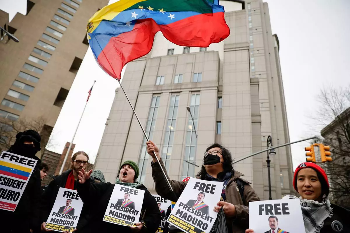 People protest outside Manhattan Federal Court before the arraignment of Venezuelan President Nicolas Maduro, Monday, Jan. 5, 2026, in New York. (AP Photo/Stefan Jeremiah)