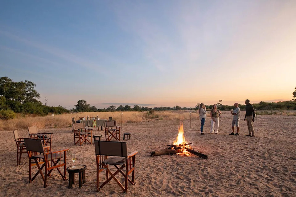 Asilia Guests enjoying a Kokoko Sundowner by the fire.