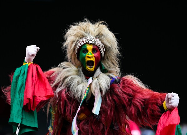 A senegal fan cheers during the Africa Cup of Nations group D soccer match between Senegal and DR Congo in Tangier, Morocco, Saturday, Dec. 27, 2025. (AP Photo/Themba Hadebe)