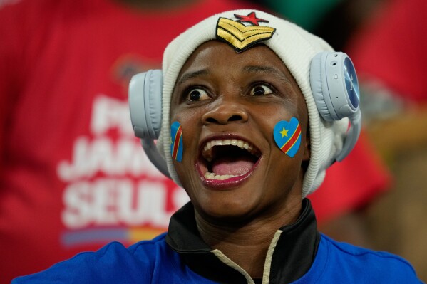 A DR Congo fan cheers prior to the Africa Cup of Nations group D soccer match between Botswana and DR Congo in Rabat, Morocco, Tuesday, Dec. 30, 2025. (AP Photo/Mosa'ab Elshamy)