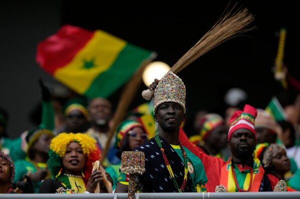 Senegal fans cheer their team during the Africa Cup of Nations group D soccer match between Senegal and DR Congo in Tangier, Morocco, Saturday, Dec. 27, 2025. (AP Photo/Themba Hadebe)