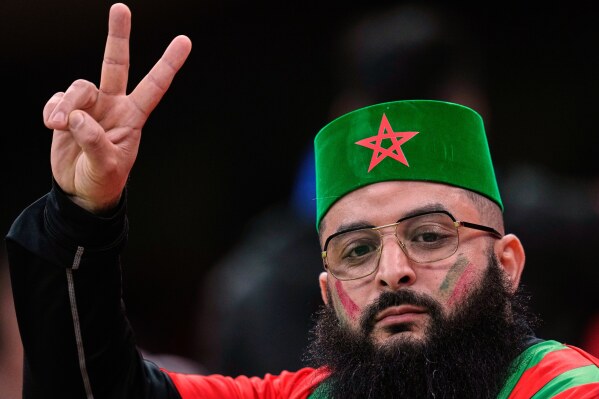 A Moroccan fan waits for the start of the Africa Cup of Nations group A soccer match between Zambia and Morocco in Rabat, Morocco, Monday, Dec. 29, 2025. (AP Photo/Themba Hadebe)