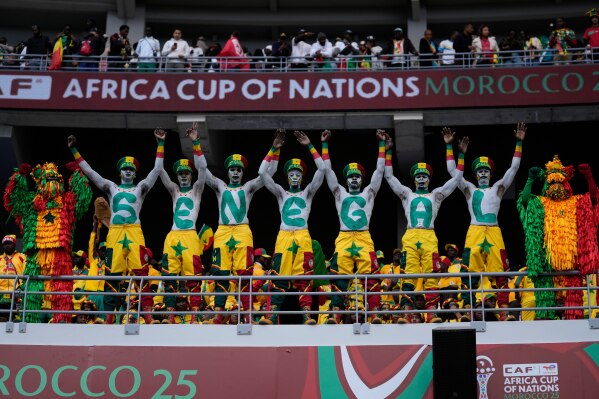 Senegal fans support their national team during the Africa Cup of Nations group D soccer match between Senegal and DR Congo in Tangier, Morocco, Saturday, Dec. 27, 2025. (AP Photo/Themba Hadebe)