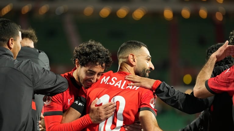 Egypt's Mohamed Salah celebrates after scoring his side's third goal...