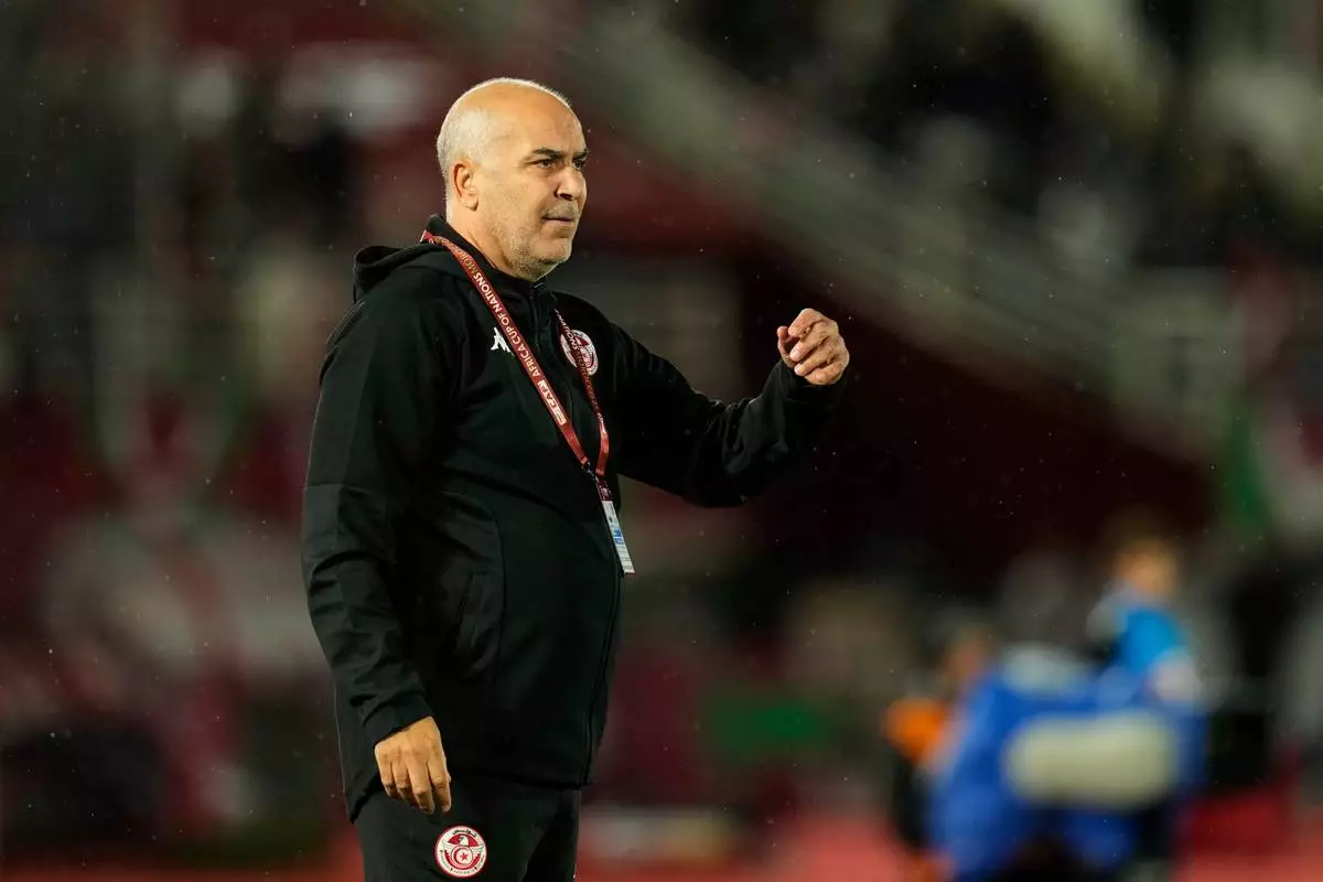 Tunisia's head coach Sami Trabelsi gestures to the players during the Africa Cup of Nations group C soccer match between Nigeria and Tunisia in Fez, Morocco, Saturday, Dec. 27, 2025. (AP Photo/Mosa'ab Elshamy)