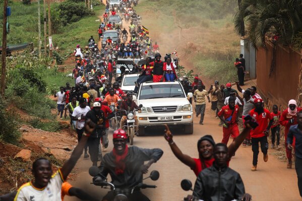 Uganda opposition presidential candidate Robert Kyagulanyi Ssentamu who is known as Bobi Wine travels in a convoy with supporters to attend an election campaign rally in Mukono, Uganda, Friday, Jan. 9, 2026. (AP Photo/Hajarah Nalwadda)