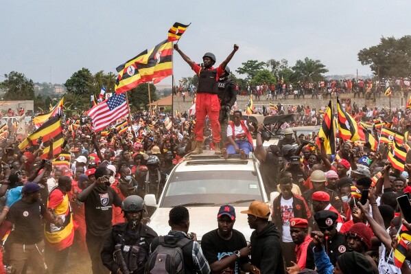 Uganda opposition presidential candidate Robert Kyagulanyi Ssentamu who is known as Bobi Wine waves to supporters at an election campaign rally in Mukono, Uganda, Friday, Jan. 9, 2026. (AP Photo/Hajarah Nalwadda)