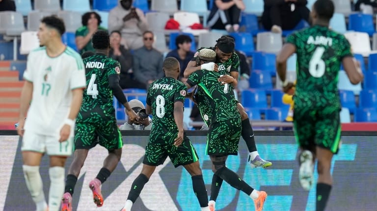 Nigeria's Victor Osimhen celebrates with teammates after scoring the opening...