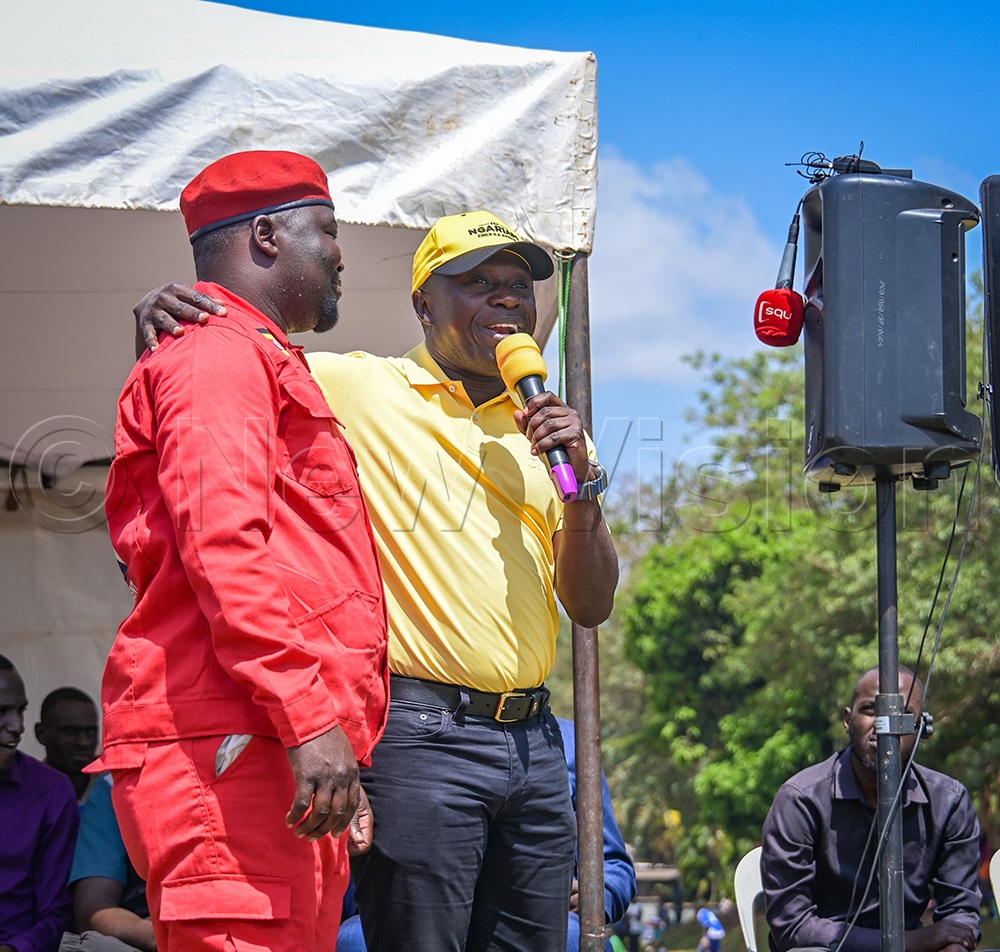 Minister Peter Ogwang with Jonathan Okware, who has been the chairperson of NUP in Teso. (Photo by Alfred Atwau)