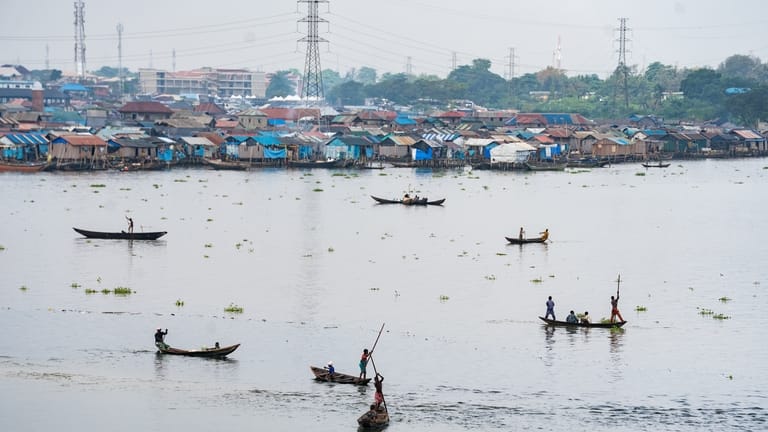 Fishermen in the lagoon in Lagos, Nigeria, on Saturday, Dec....