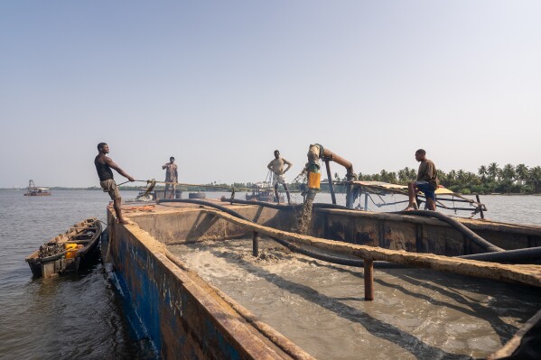 Sand extraction in progress on Lagos waters, Saturday, Dec. 6, 2025. (AP Photo/Grace Ekpu)