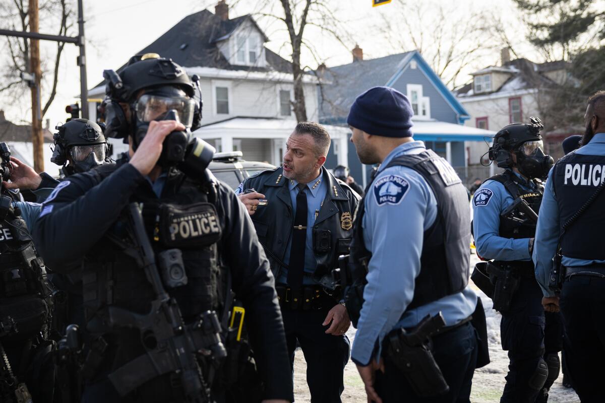 Minneapolis police chief Brian O'Hara speaks with officers at the scene where a federal agent shot and killed an observer in Minneapolis on Wednesday, Jan. 7, 2026.