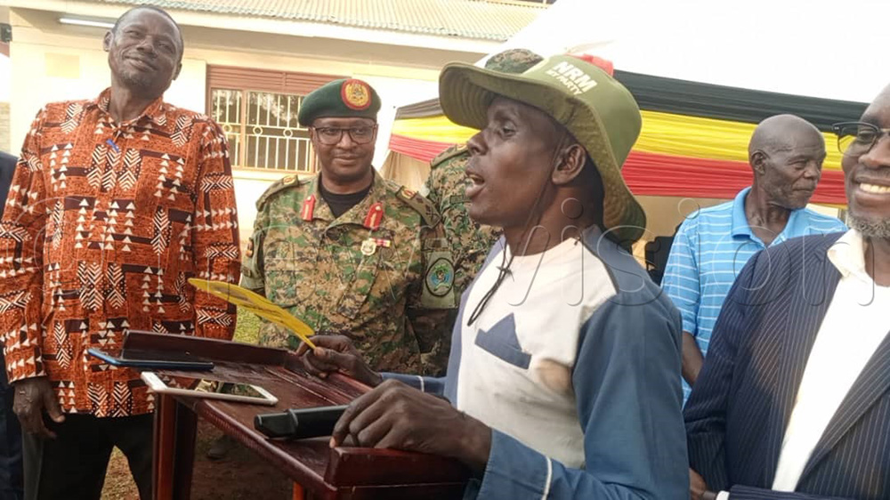 Simon Opige a mobiliser among LRA remnants addressing journalists. (Photo by Christopher Nyeko)