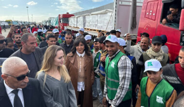 US actress Angelina Jolie speaks to employees of aid agencies at the Egyptian Rafah border crossing, part of her visit to the North Sinai Governorate to inspect aid entering the Palestinian Gaza Strip, on January 2, 2026.