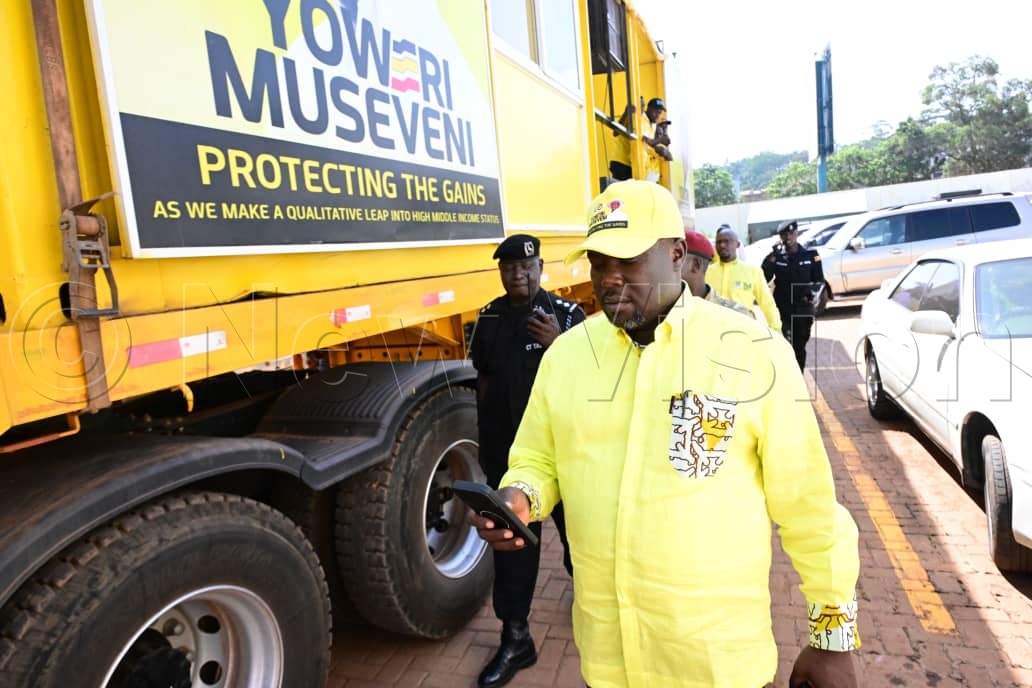 NRM secretary general, Richard Todwong, receiving the hard copies of the national voters register from the Electoral Commission (EC) headquarters in Kampala, ahead of polling day. (Credit: Mpalanyi Ssentongo)