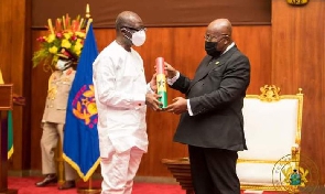 Ken Ofori-Atta and former President Nana Addo Dankwa Akufo-Addo during a swearing-in ceremony