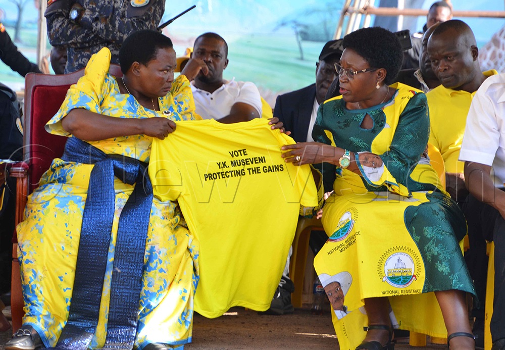 Prime Minister Robinah Nabbanja and Rosemary Sseninde, unveiling President Museveni's T-shirt in Kasokoso. (Credit: Stuart Yiga)