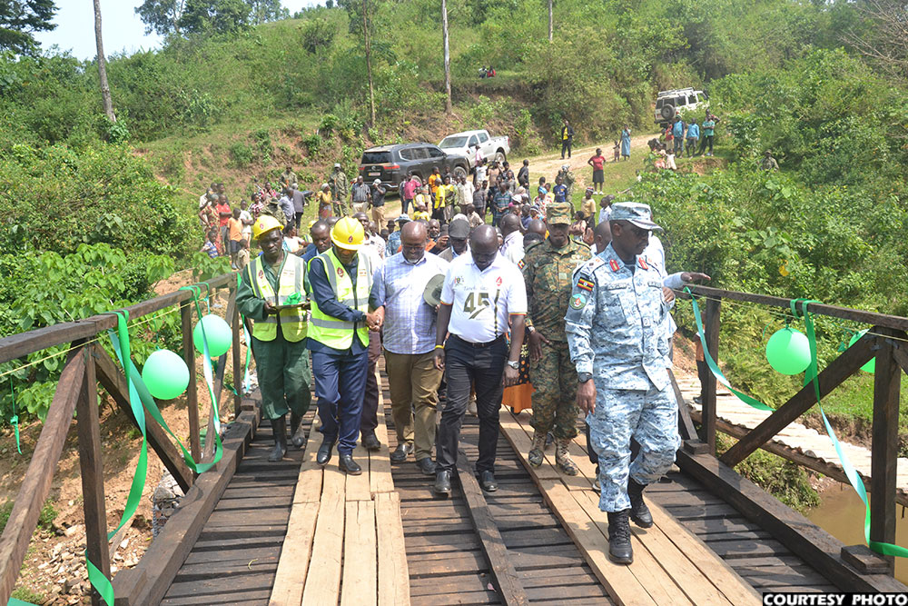 Gen. Wilson Mbadi inspecting the Kihanda Kambuga bridge after handing it over to the community in Kanungu.