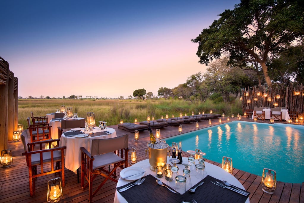 A romantic dinner by the pool at andBeyond Nxabega Okavango Tented Camp in Botswana. Photo: Handout