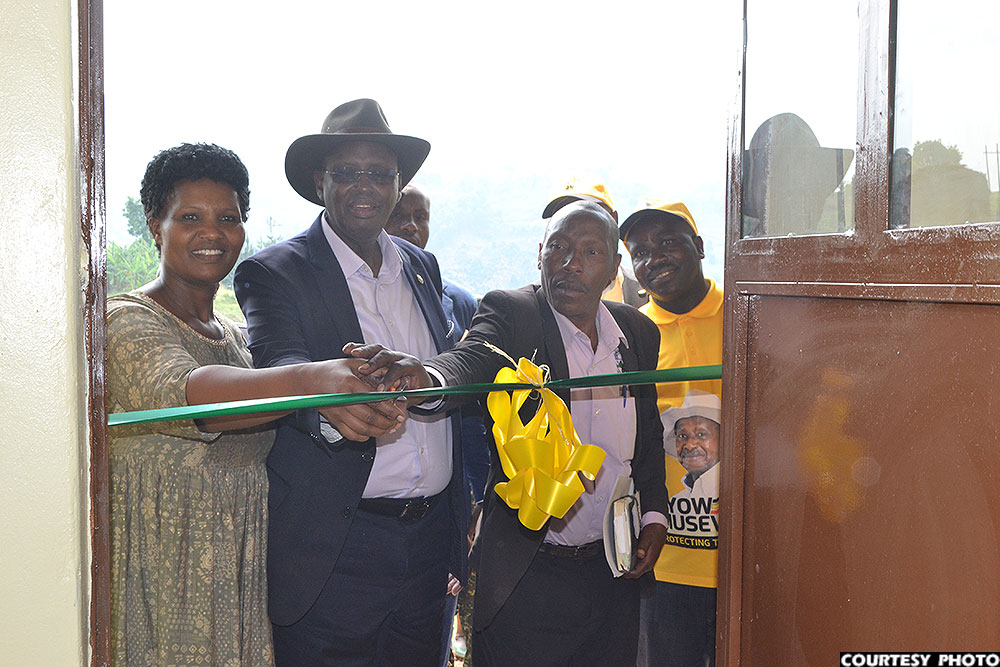 Minister Rwamirama commissioning a two-classroom block at Bizenga Primary School.