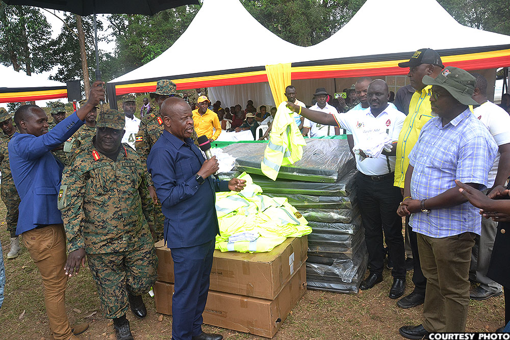 Minister Mbadi handing over medical beds to Kanungu district officials.