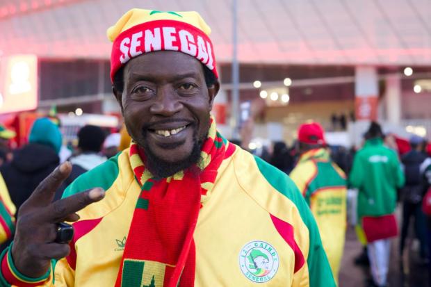 Senegal fan Sheikh Sy, one of the official supporters who accompany the team wherever it plays, at the Africa Cup of Nations in Tangier, Morocco, Dec. 23, 2025. (AP Photo/Ciaran Fahey)