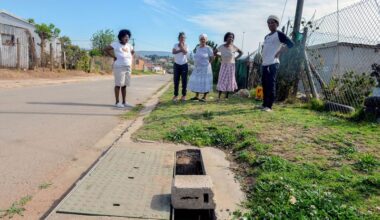 Residents of Grootboom Street, where a toddler drowned in a broken drain in September 2014. While the drain was fixed in 2021, part of the cover has once again been vandalised. (Photo: Deon Ferreira)