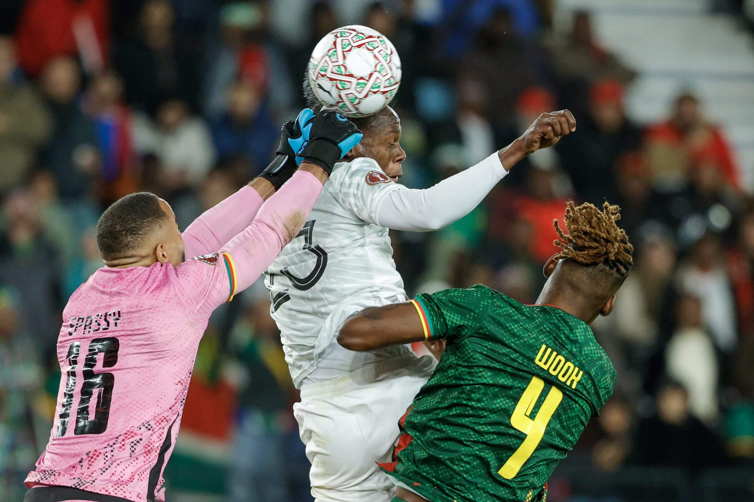 Cameroon's goalkeeper Devis Epassy challenges Evidence Makgopa in the air