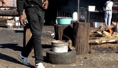 A rat looks for food at a shishanyama at Madala Hostel in Alexandra township, Johannesburg, South Africa. August 29, 2025. (Photo: OUR CITY NEWS / James Oatway)