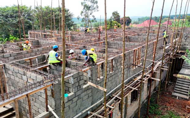 Apprentices with Teach Men to Fish, a Ugandan nonprofit that trains youth in construction, work to build walls for a community health center in the Mityana District on April 19, 2024. (Photo provided by Mark Miller).