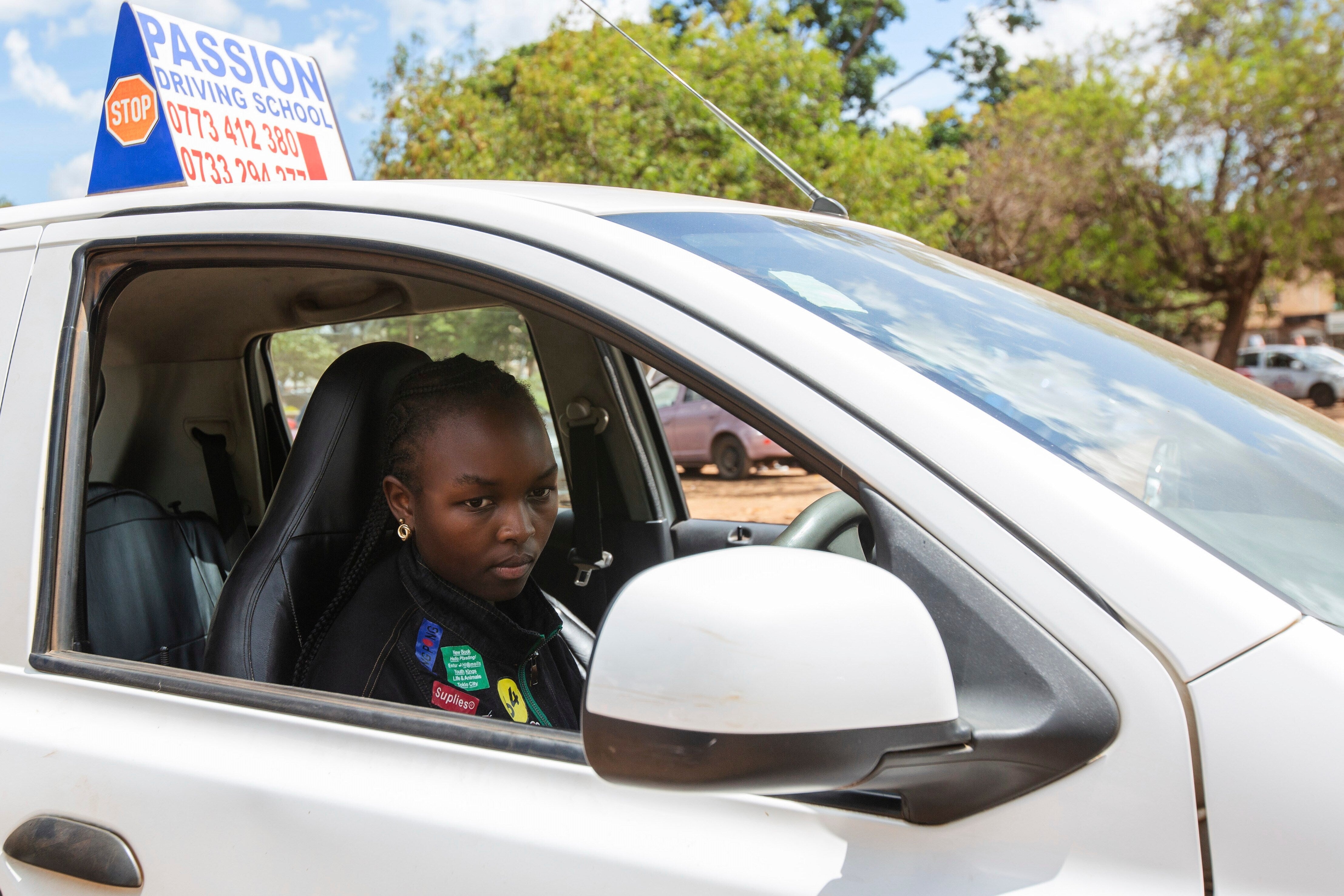 Winfrida Chipashu takes road driving lessons in Harare, Zimbabwe, Tuesday, Dec. 16, 2025. (AP Photo/Aaron Ufumeli)
