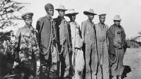 Ullstein Bild / Getty Images Ovaherero men arrested by German and put in chains circa 1904-1905 during the genocide.