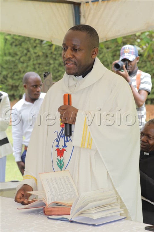 Fr. Samuel Kaboggoza preaching during a prayer session held at their home in Kasangati, Wakiso district.