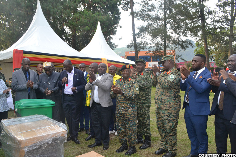 Here, the Rwamirama hands over assorted medical equipment to the Kisoro district officials headed by RDC Haji Badru Ssebyala.