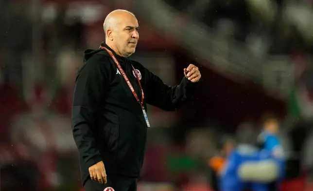 Tunisia's head coach Sami Trabelsi gestures to the players during the Africa Cup of Nations group C soccer match between Nigeria and Tunisia in Fez, Morocco, Saturday, Dec. 27, 2025. (AP Photo/Mosa'ab Elshamy)