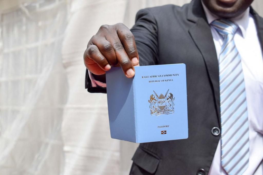 A man showing his Kenyan passport