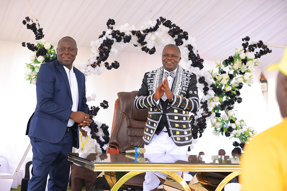 Special Presidential Assistant, Press and Mobilisation, also Deputy Press Secretary, Haji Faruk Kirunda with Prophet David Isanga. (Courtesy)