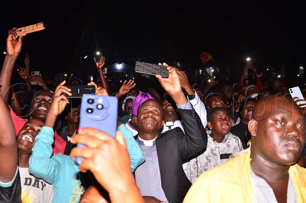 The Vicar of Christ's Cathedral Bugembe the Rev. Can. Mathias Katiko recording fireworks as they welcomed the New Year at the premises on Thursday. (Credit: Jackie Nambogga)