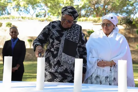 Reuters Namibia's first female President, Netumbo Nandi-Ndaitwah, and Vice-President Lucia Witbooi, light a ceremonial candle as the country holds its first commemoration for victims of the genocide.
