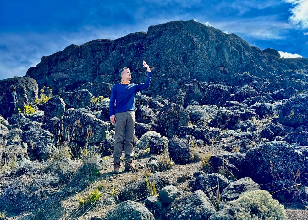 person taking a selfie in a rocky outdoor landscape