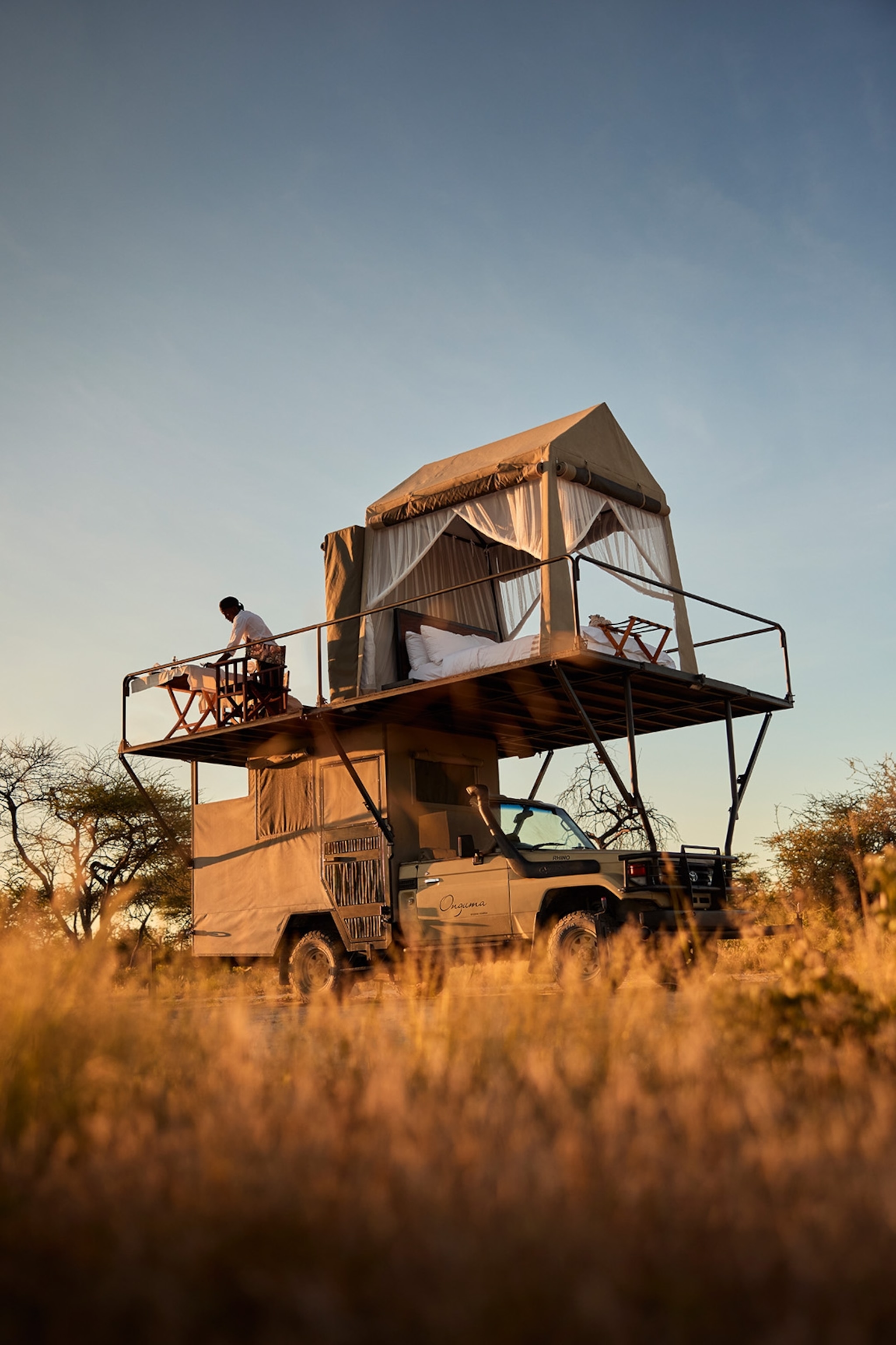 A Land Cruiser adapted to have a double bed and terrace on the roof.