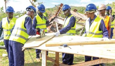 A team of Ghanaian and Jamaican soldiers working on one of the homes