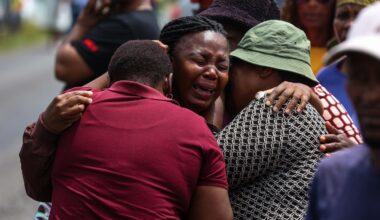South African authorities revise death toll in school bus crash to 12 as driver is arrested