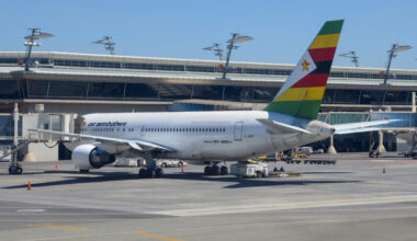 Air Zimbabwe Boeing 767 parked at the gate.