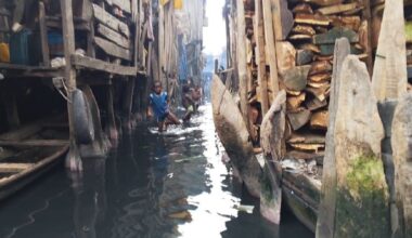 Children playing in murky water