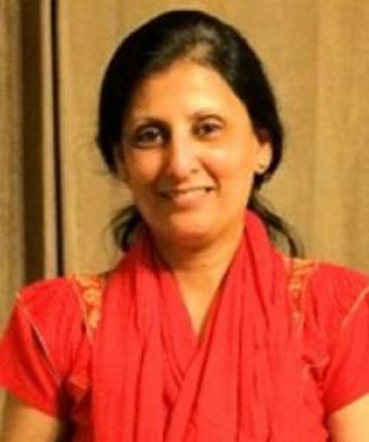 Indian woman in red outfit