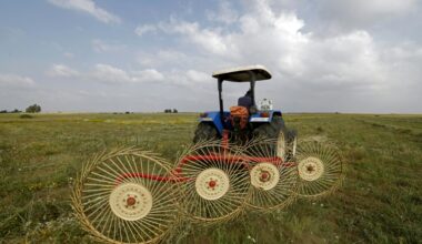 A farmer uses a hay-collecting machine in a field in the Zehiliga region of Morocco. Rising fertiliser costs are threatening the livelihoods of many farmers